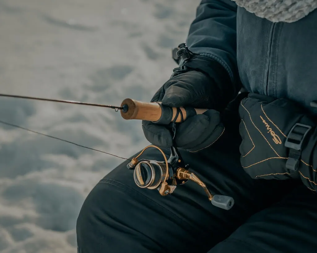 Holding a Rod while Ice Fishing