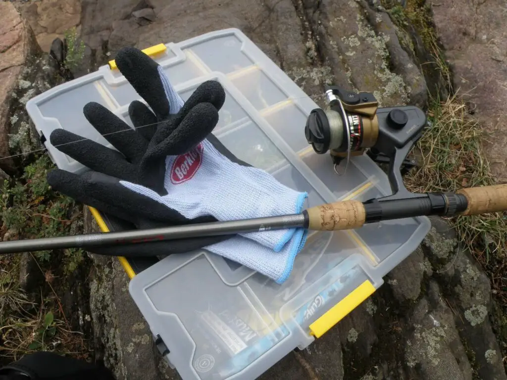 Fishing tackle box with rod and gloves