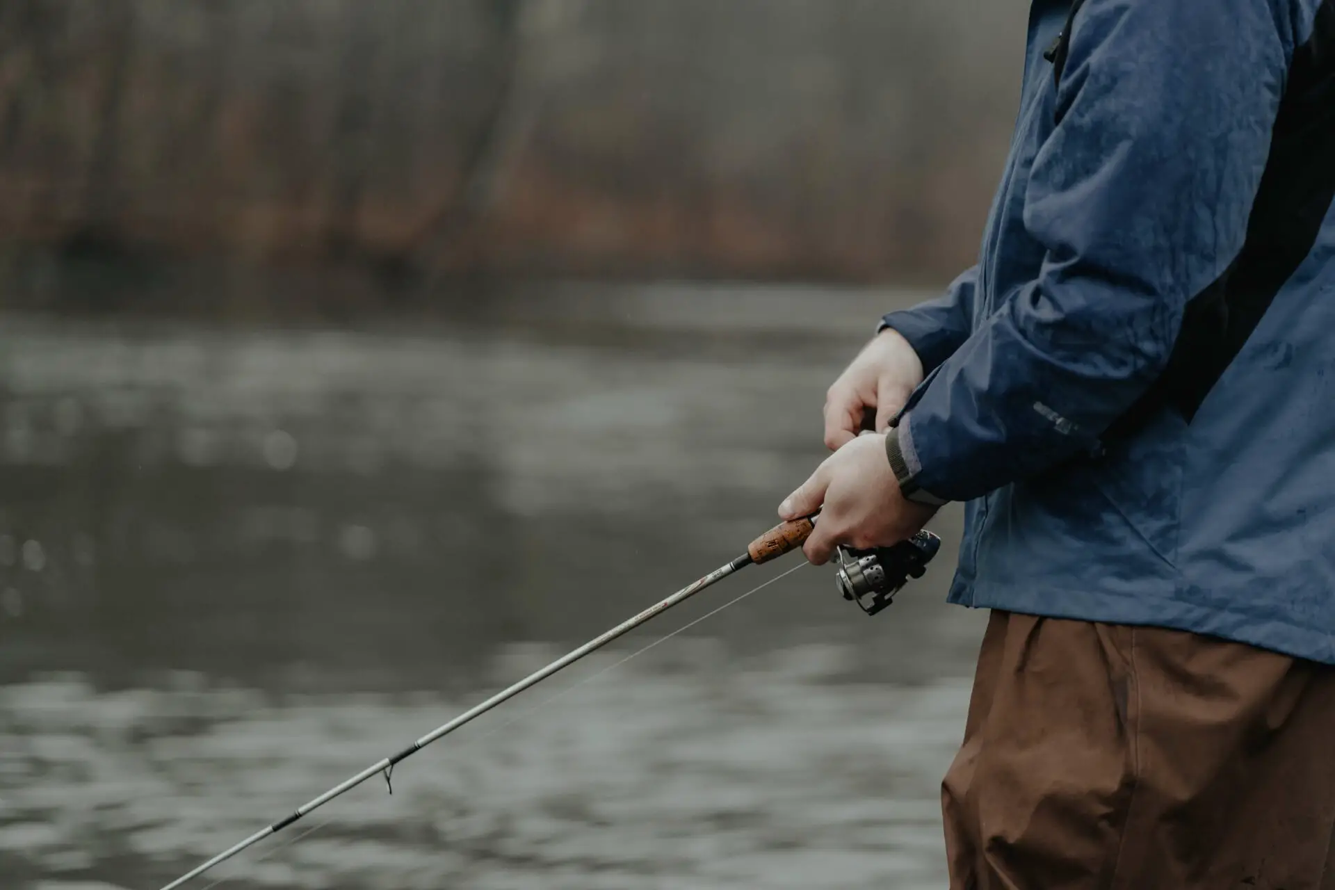 Fisherman with rod and ultralight spinning reel