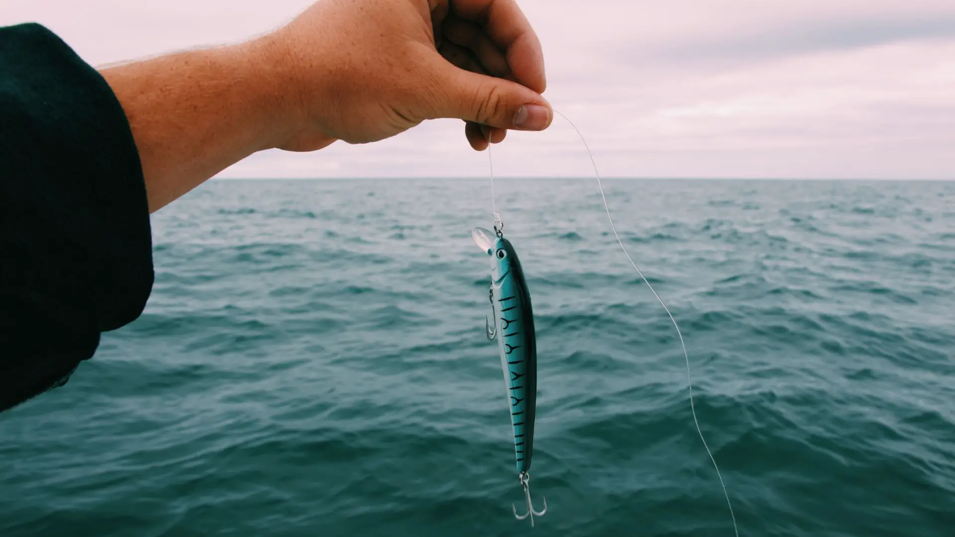 Man holding a fishing lure